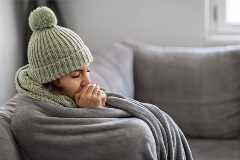 Woman Warming Up in Blanket
