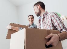 Young couple moving boxes
