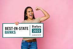 Girl holding best-in-state bank sign