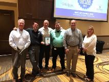 CoreFirst staff poses with award